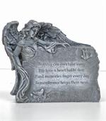 Angel holding memory stone that reads,