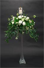 Bridal white rose mixed with white carnations and Italitan ruscus with white votive candle