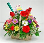 While cakes make it a birthday, flowers make it a party. We filled this  white basket  with colorful birthday wishes. Red and pink carnations, white and yellow daisies, astros, purple statice, yellow solidago,bright red freedom roses with baby breath and 