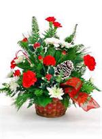 A lovely arrangement of red carnations with white mini carnations, holly, holiday evergreens, pine cones and baby breath is a sure way to bring holiday cheer to any table.