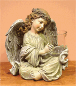 Angel with candle holder measures 10