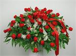 Designed with three dozen red roses our “Serenity Garden” casket piece is a fitting way to honor a love one. Included in the design are million star baby breath with mixed greenery and a ribbon banner with your choice of script. When words fail us, flower