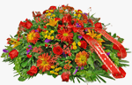 Casket Spray of bronze colored rover mums with golden yellow button pomps, orange colored asiatic lilies, red winter berries, and red roses and mixed greens. Ribbon add with your choice of sentiment.